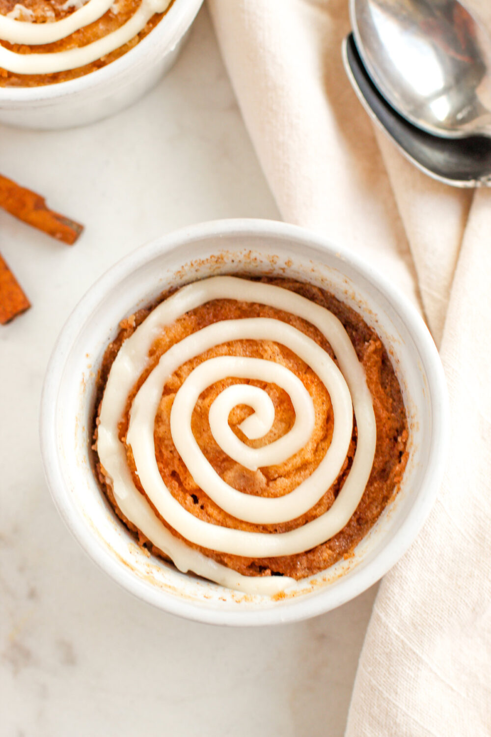 Cinnamon roll cake in a little dish.