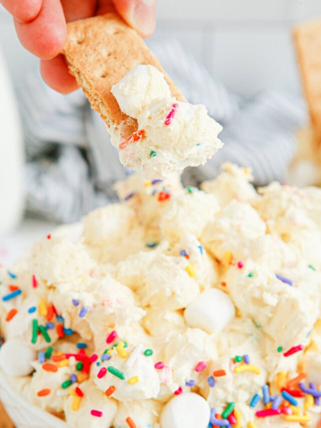 Dipping a graham cracker into birthday fluff.