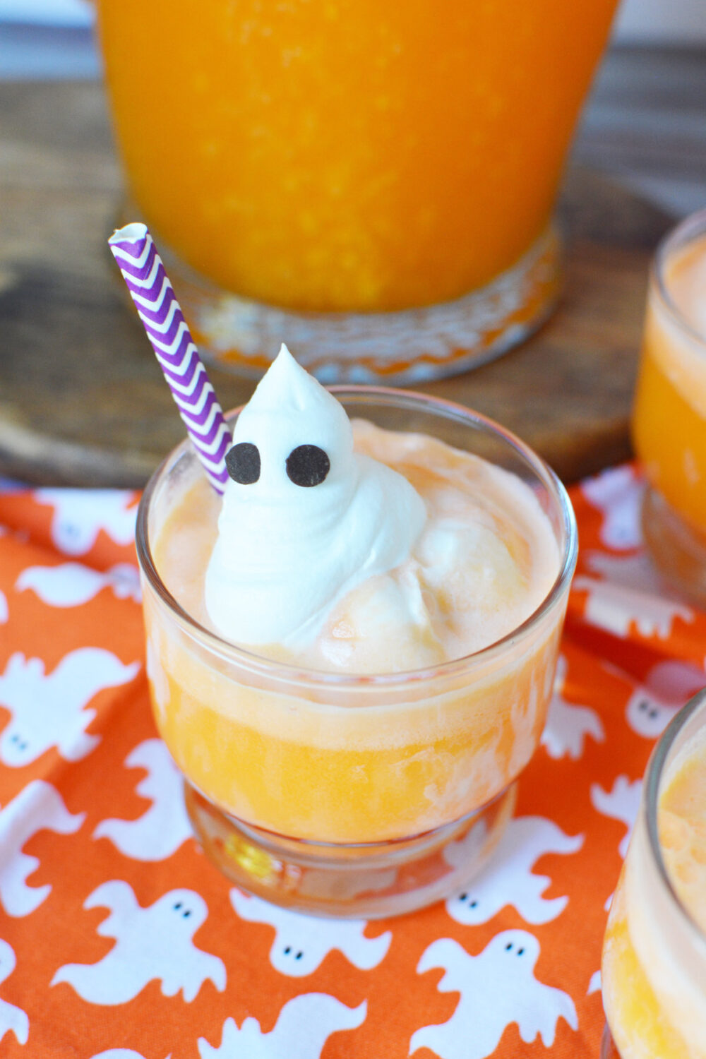 Orange punch with a whipped ghost topping with chocolate chip eyes. 