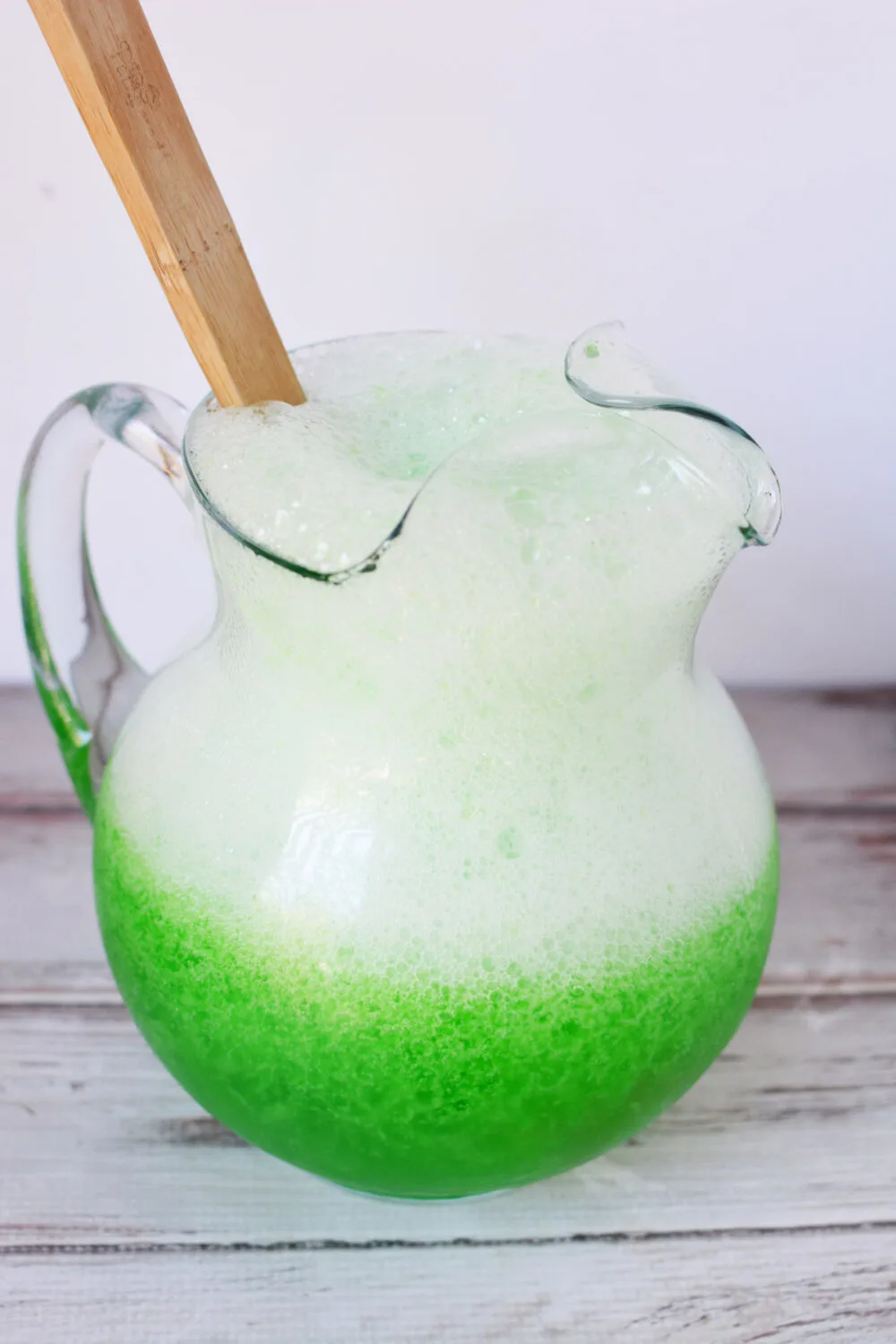 Pitcher of goblin goo green Halloween punch. 