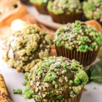 Banana blueberry muffins with a green crumble to look like mold for Halloween.