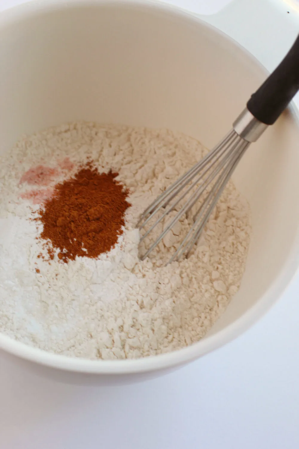 Flour and pumpkin spice in a bowl. 