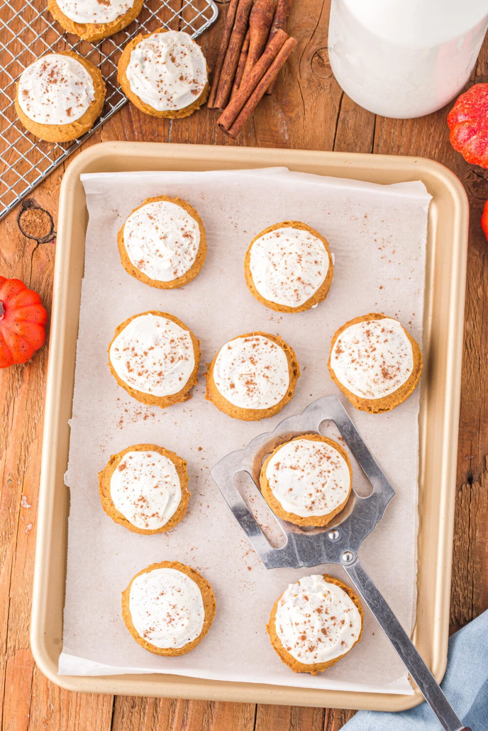 Iced cookies on a baking sheet.