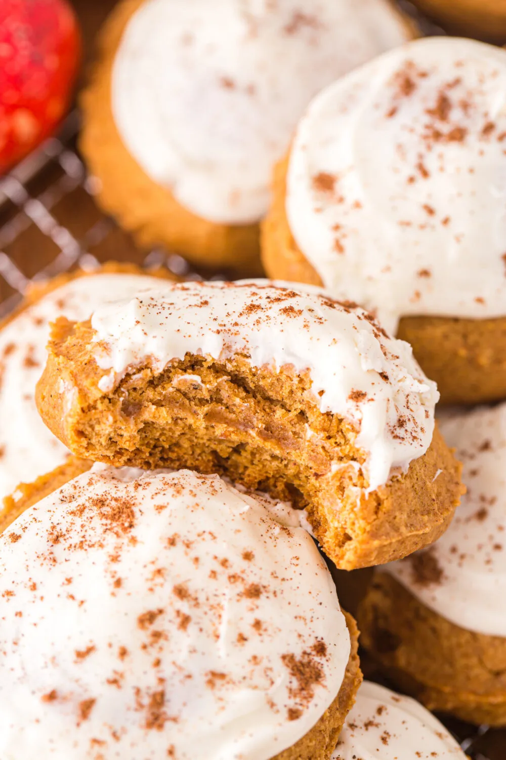 Pumpkin cookie with a bite taken out.