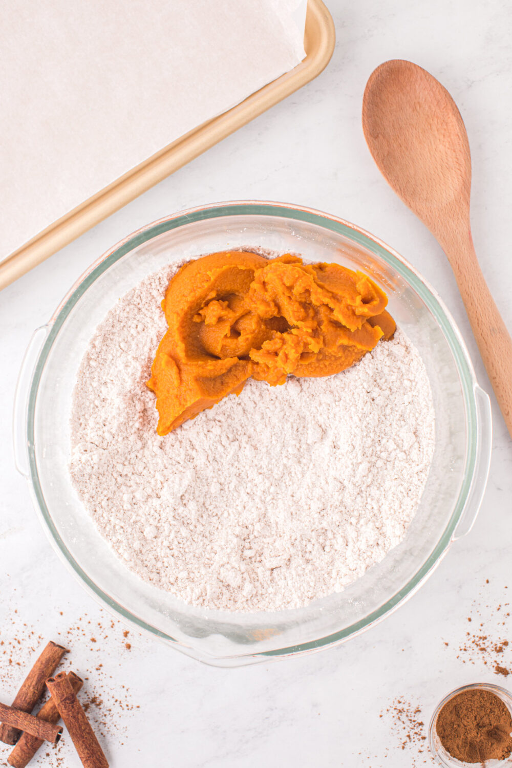 Pumpkin puree in a bowl of dry mix.