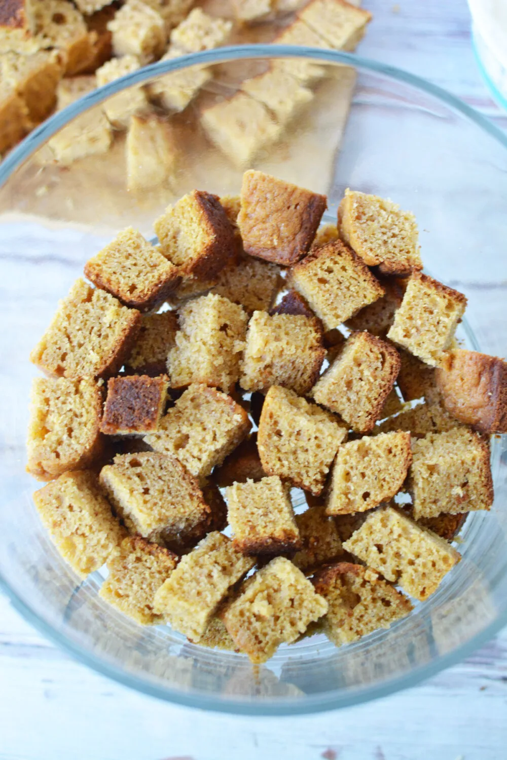 Pumpkin bread cubes in a trifle bowl. 