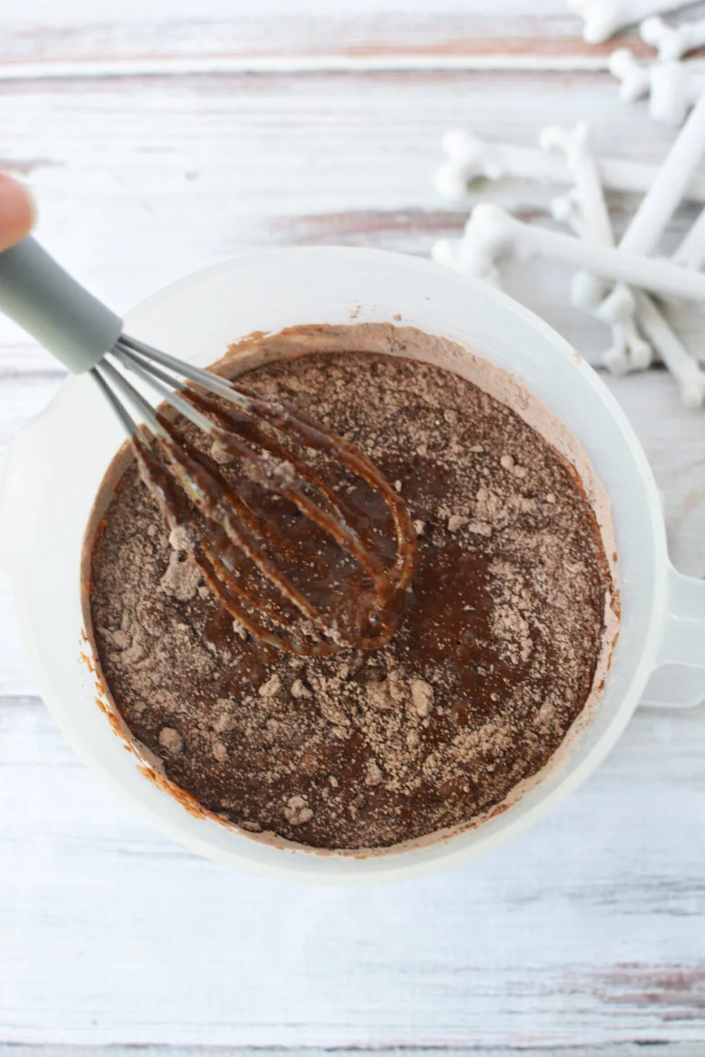 Mixing chocolate pudding with a whisk. 