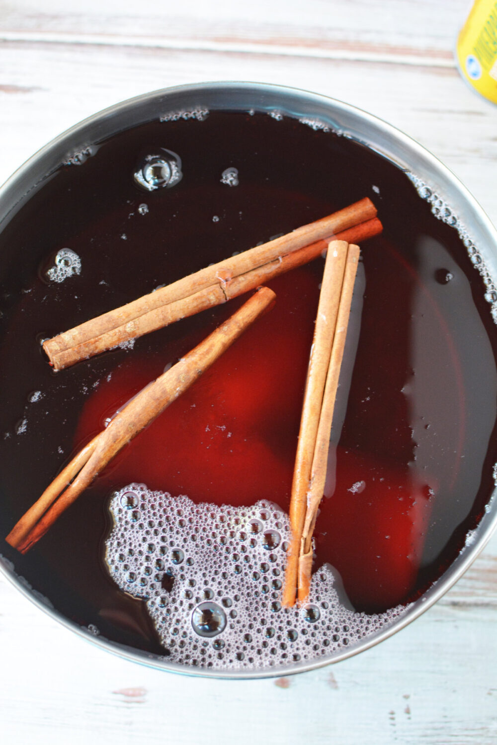 Cinnamon sticks floating in punch. 