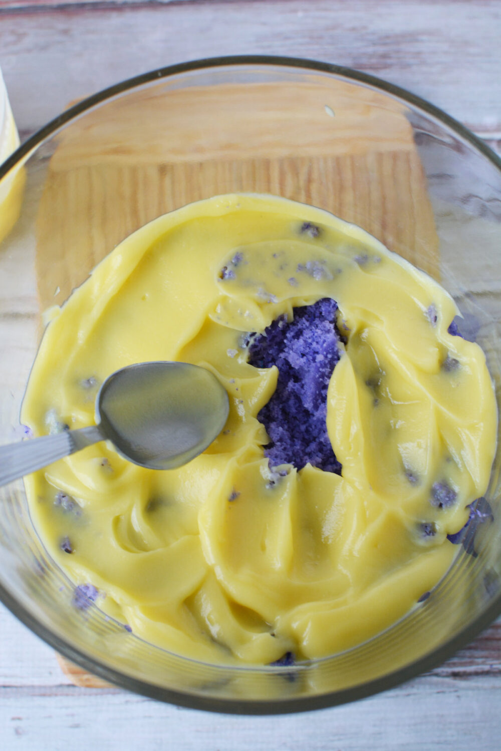Purple cake and vanilla pudding in a trifle bowl. 