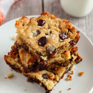 Salted caramel chocolate chip cookies bars stacked on a plate.