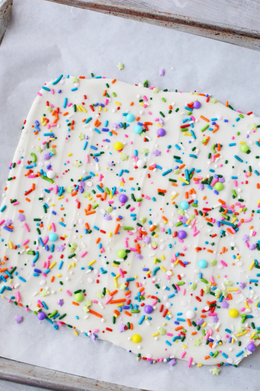 Funfetti bark candy on a baking sheet. 