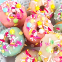 Mini donuts with colorful glaze and sprinkles.
