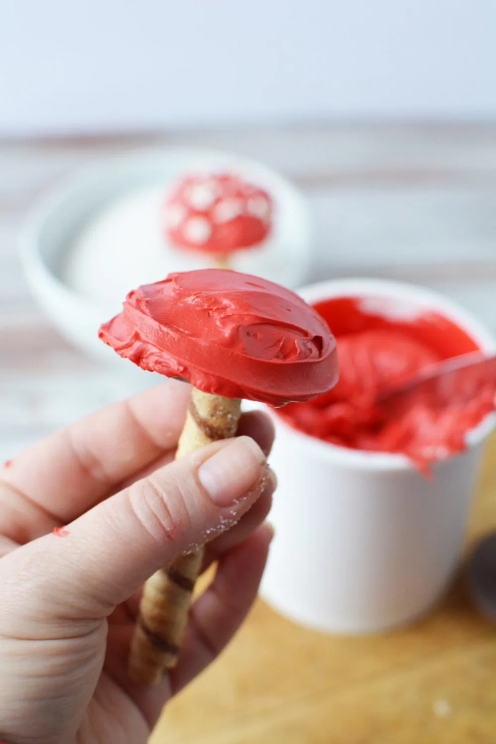 Red frosting on an edible toadstool.