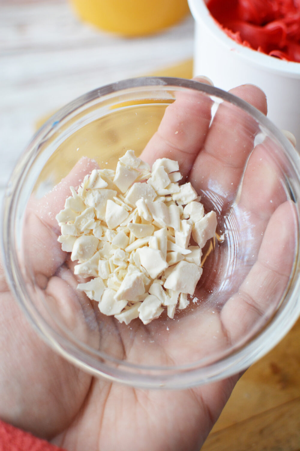Crushed white candy melts in a bowl.