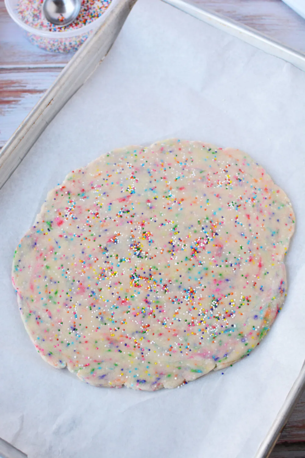 Rolled shortbread dough on a sheet.