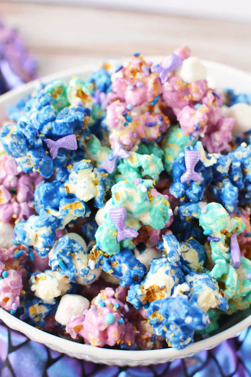 Mermaid party popcorn with sprinkles in a bowl.