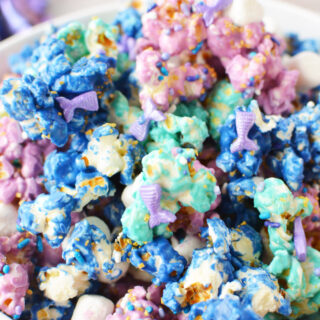 Mermaid party popcorn with sprinkles in a bowl.