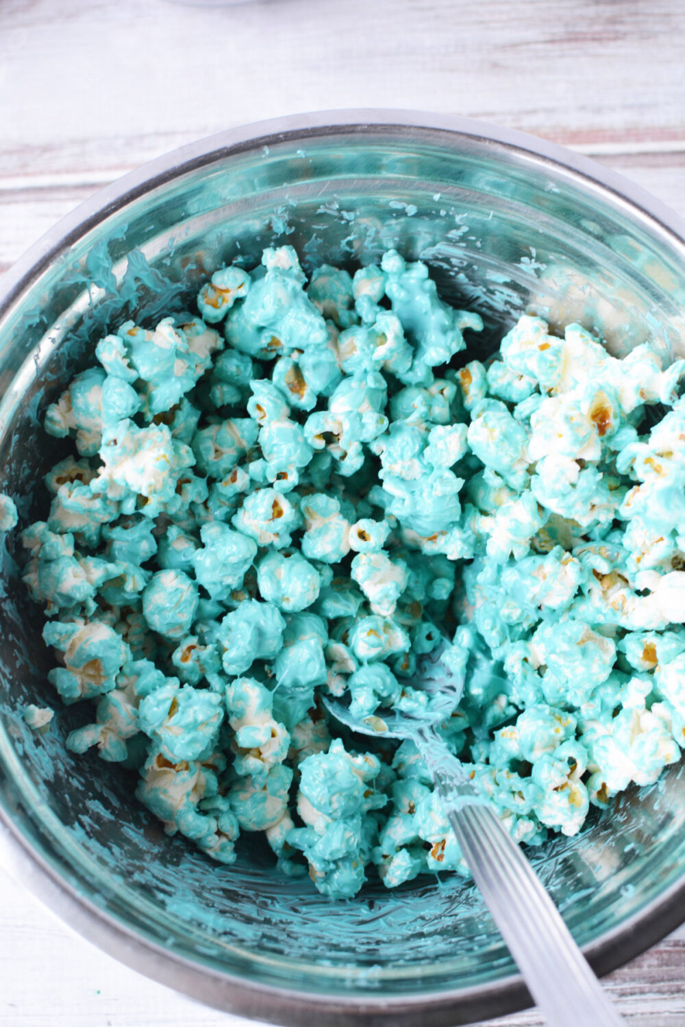 Popcorn coated with blue melted candy.