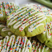 Lime cookies in a pile on a plate.