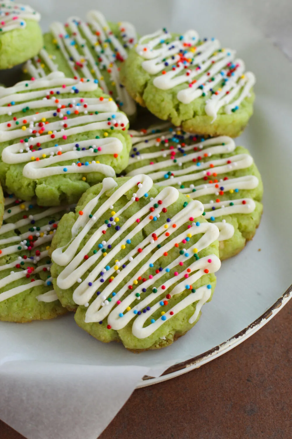 Lime cake mix cookies with sprinkles on a plate.