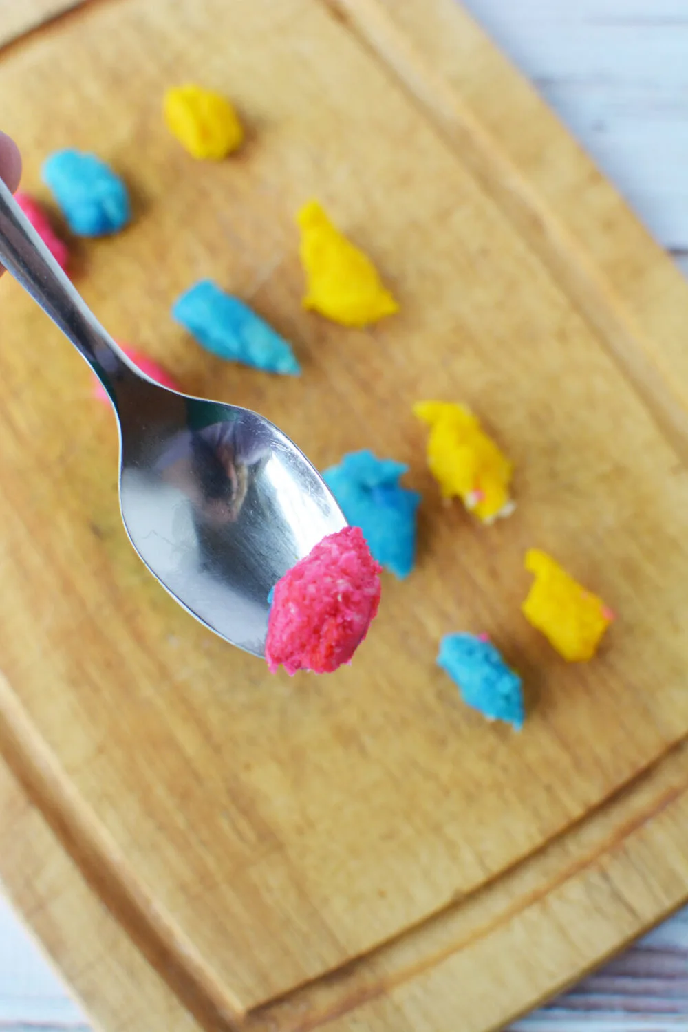 Spoon of pink cookie dough.