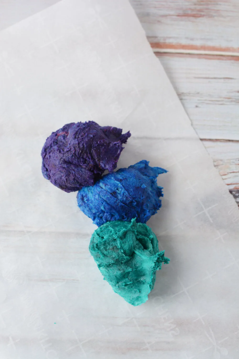 Blue, green, and purple dough. 