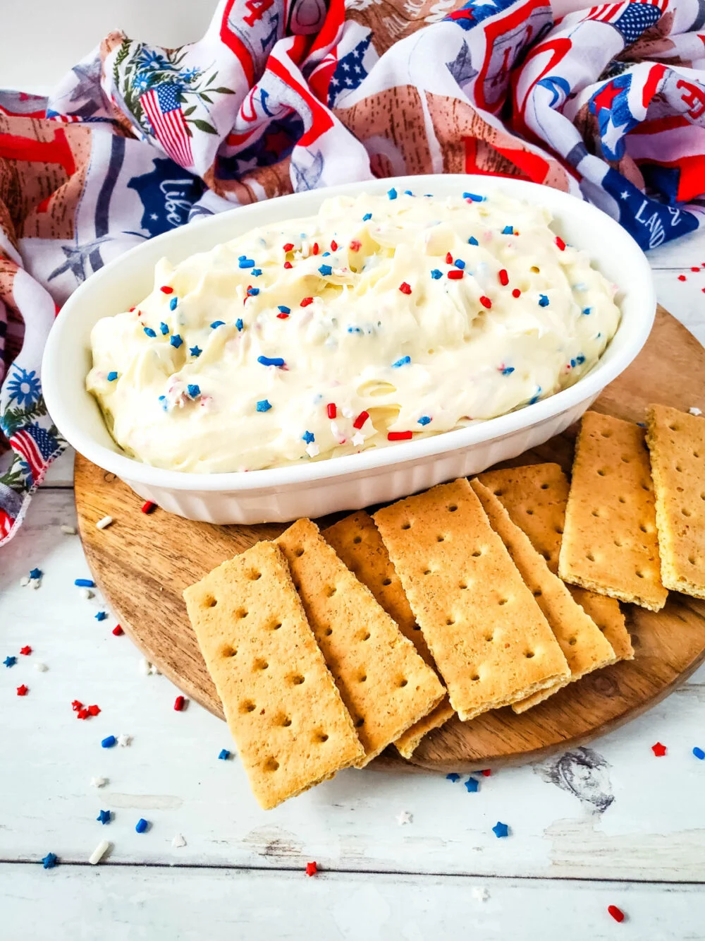 Cream cheese dessert dip with patriotic sprinkles and graham crackers for dipping. 