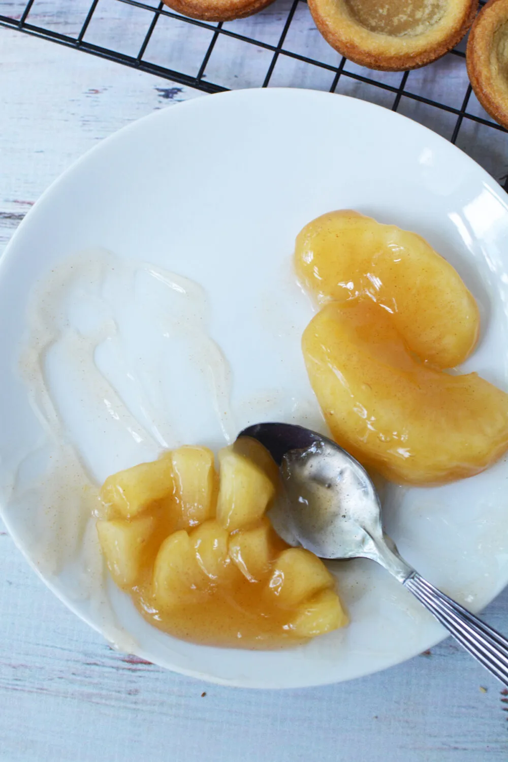 Dicing apple pie filling into smaller chunks. 