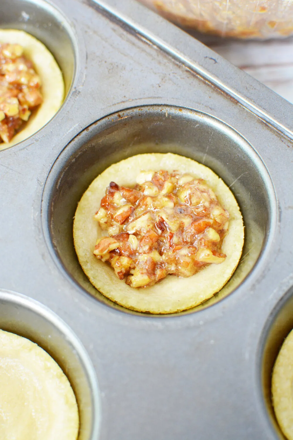 Pecan mixture in cookie crusts. 