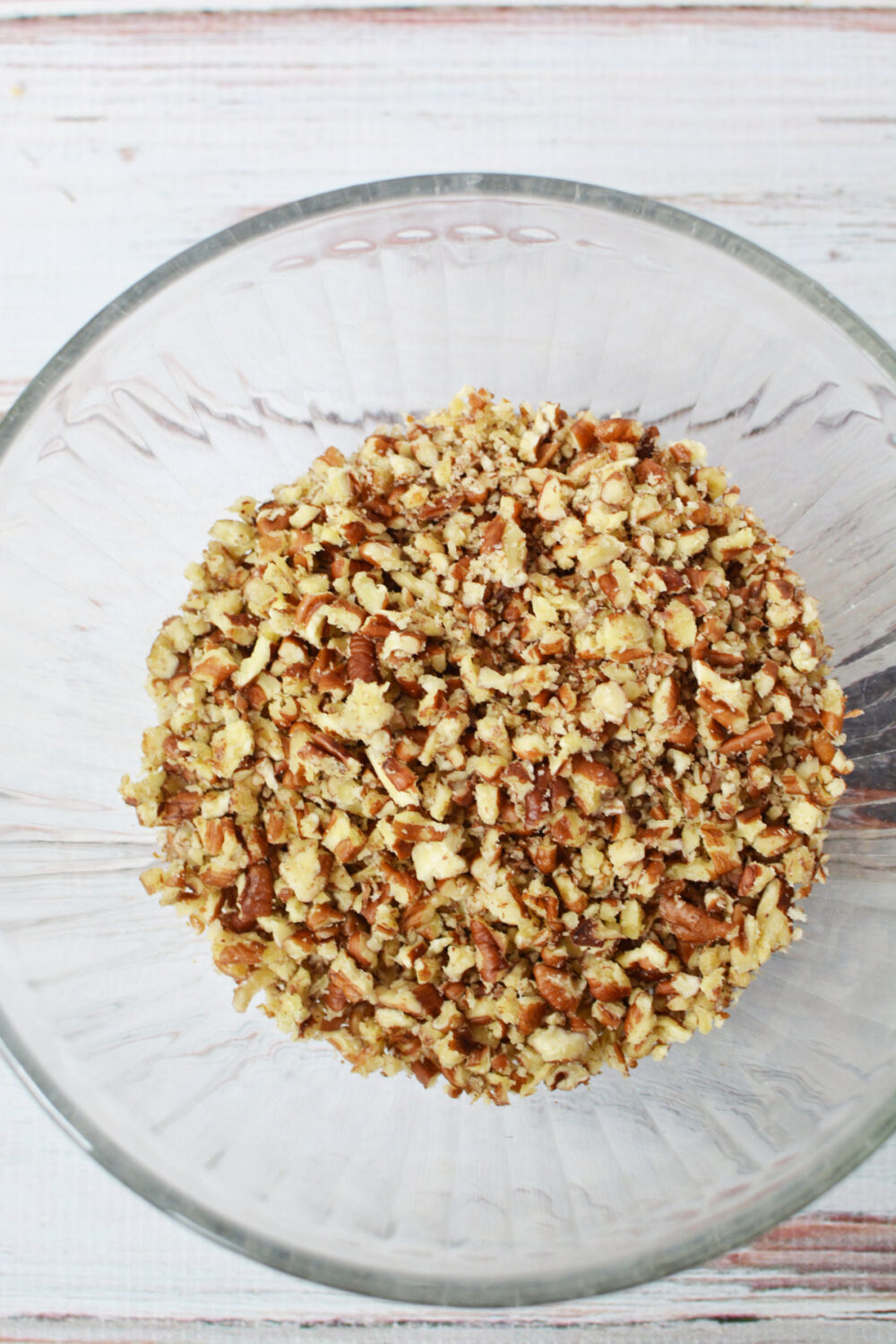 Chopped pecans in a bowl.