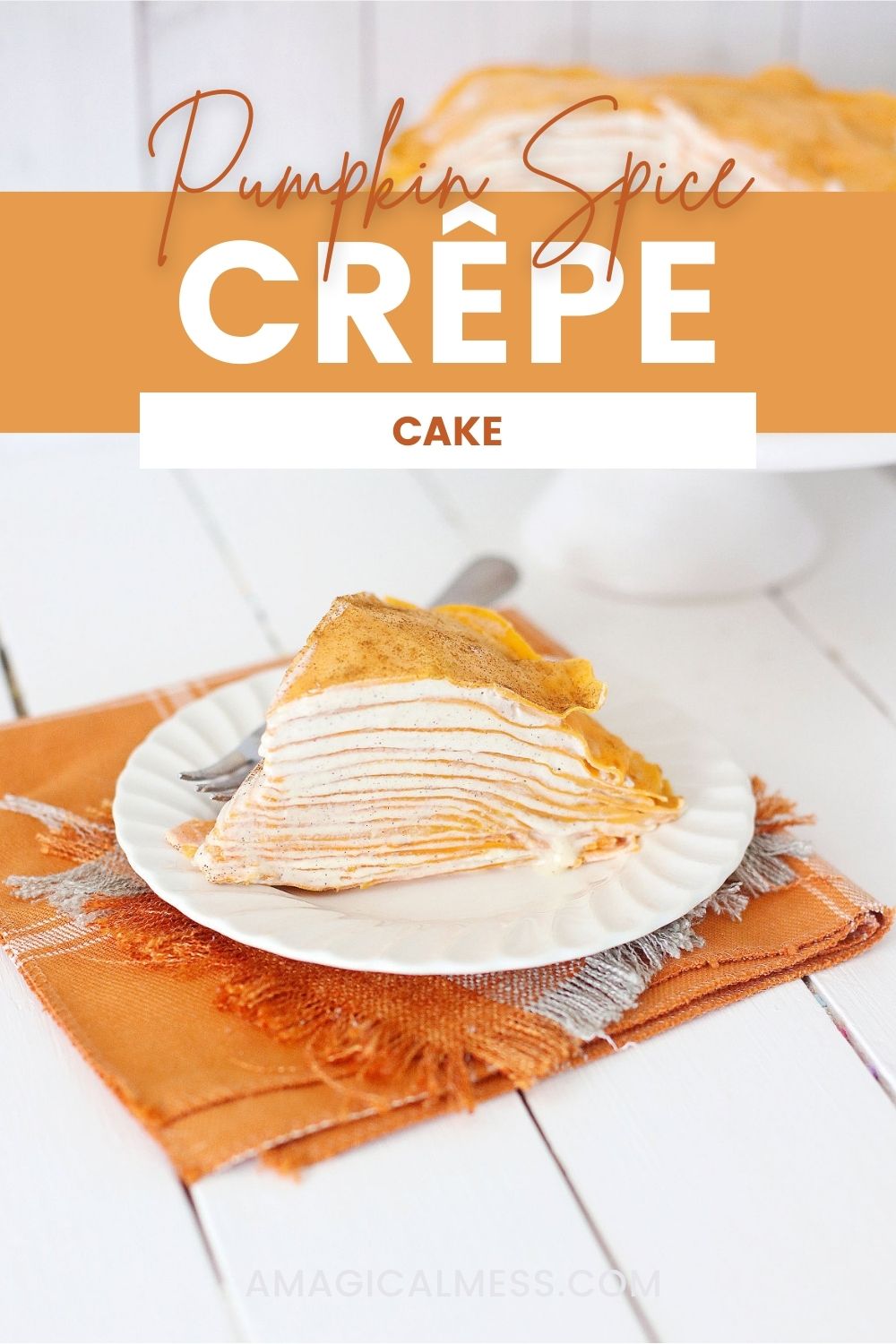 Pumpkin crepe cake on a plate and an orange napkin.