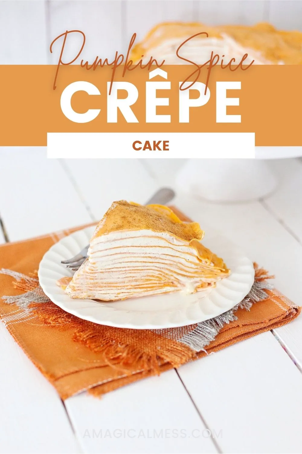 Pumpkin crepe cake on a plate and an orange napkin. 