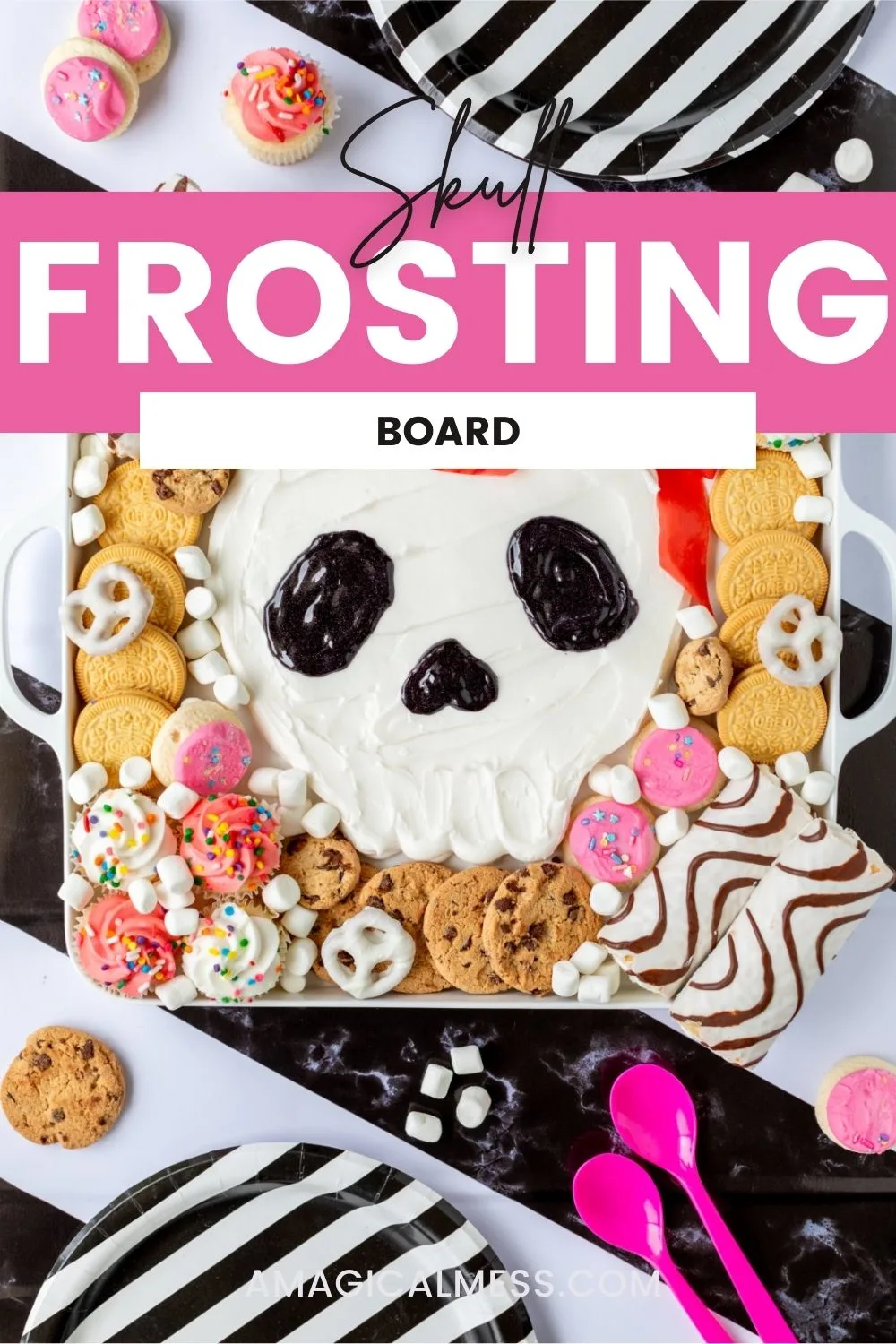 Halloween sugar skull buttercream board with cakes and cookies on a striped background. 