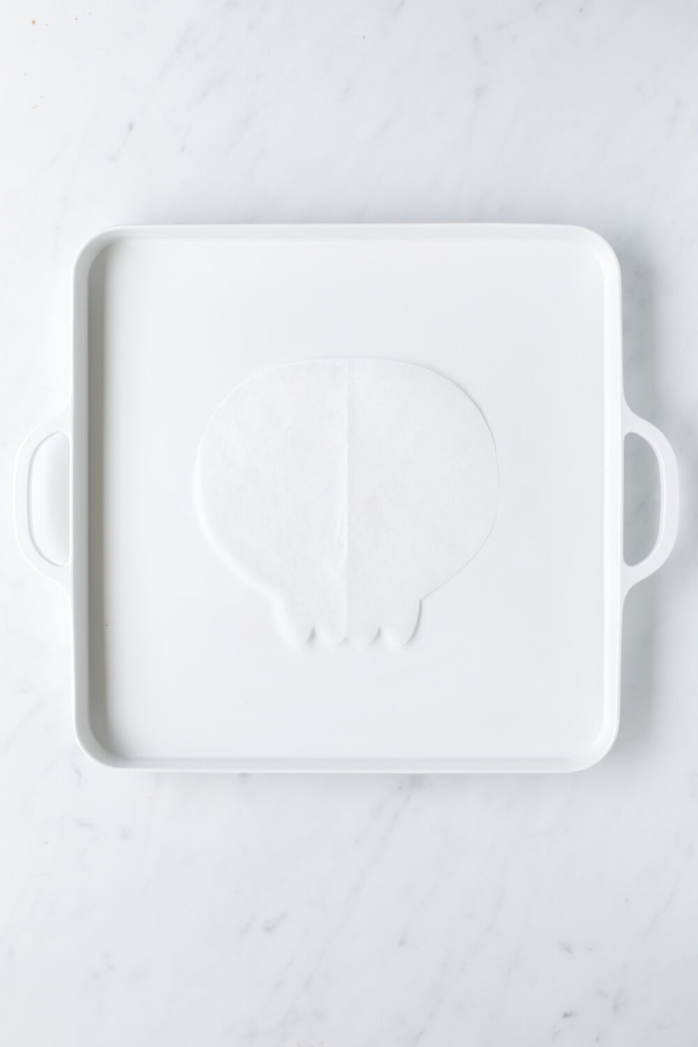 Skull template on a white serving board. 