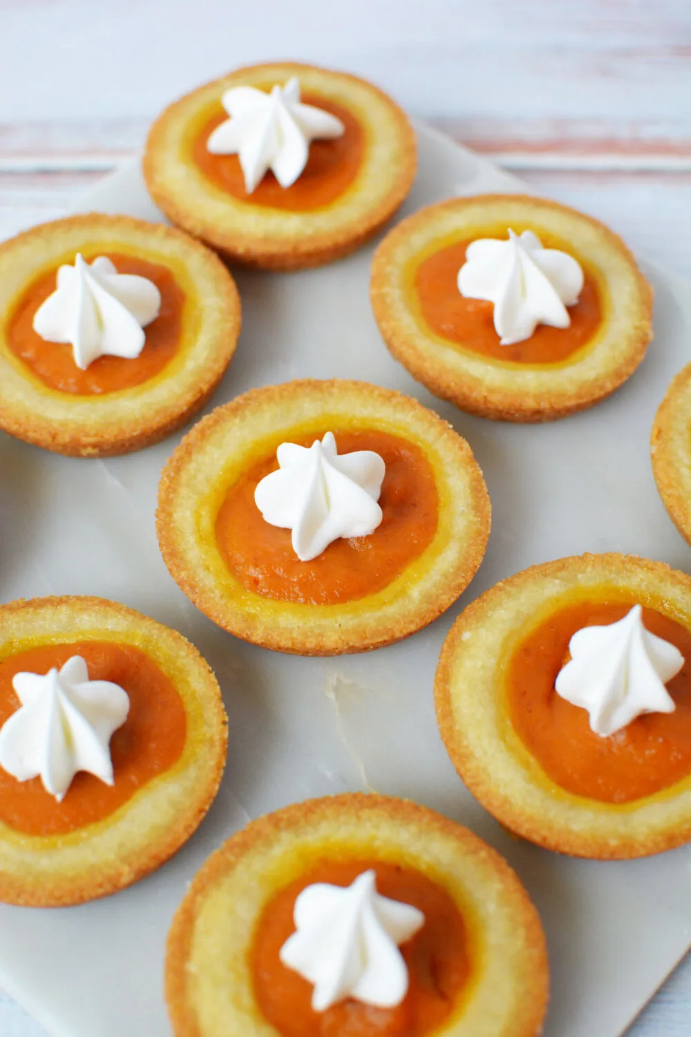 Pumpkin pie cookies on a board.