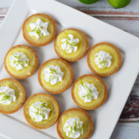 Key lime pie cookies on a white serving tray.
