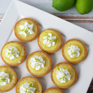 Key lime pie cookies on a square plate.