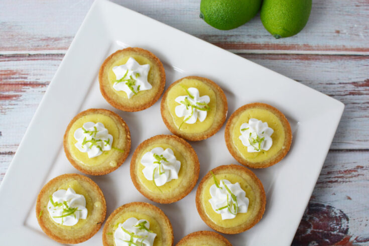 Key lime pie cookies on a square plate.
