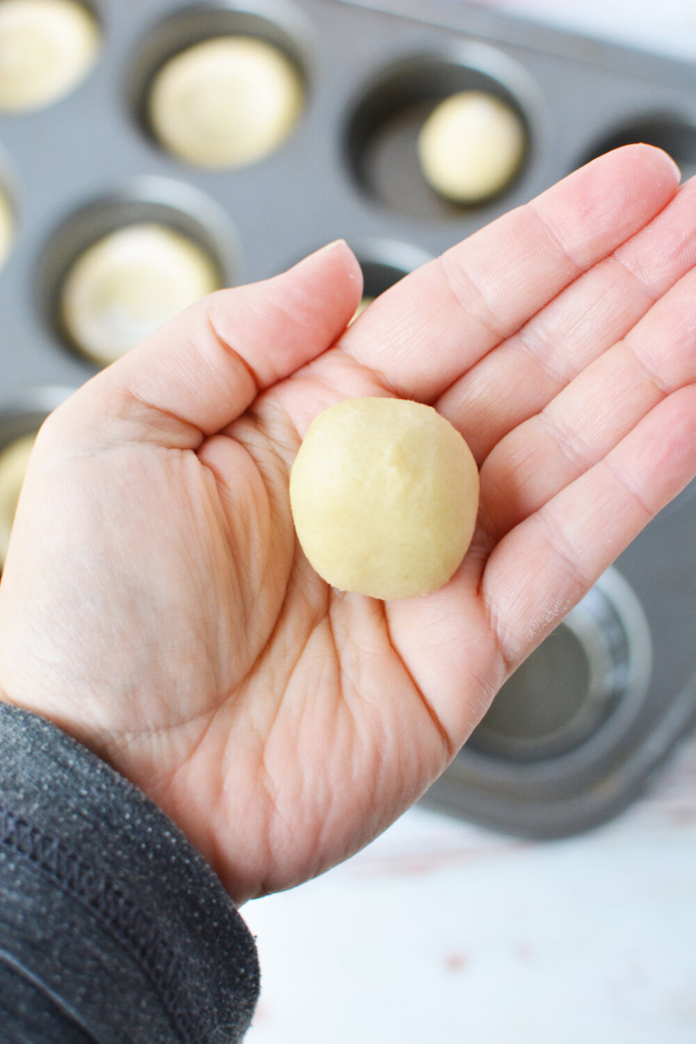 Rolled sugar cookie dough ball. 