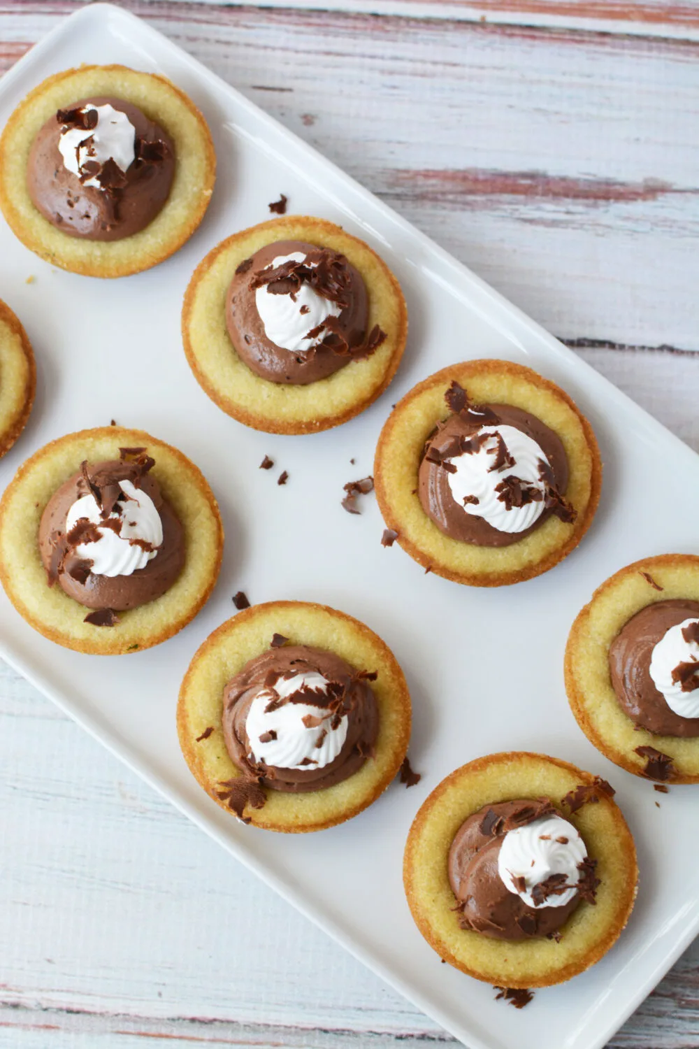 French silk pie cookies with whipped cream and chocolate shavings.