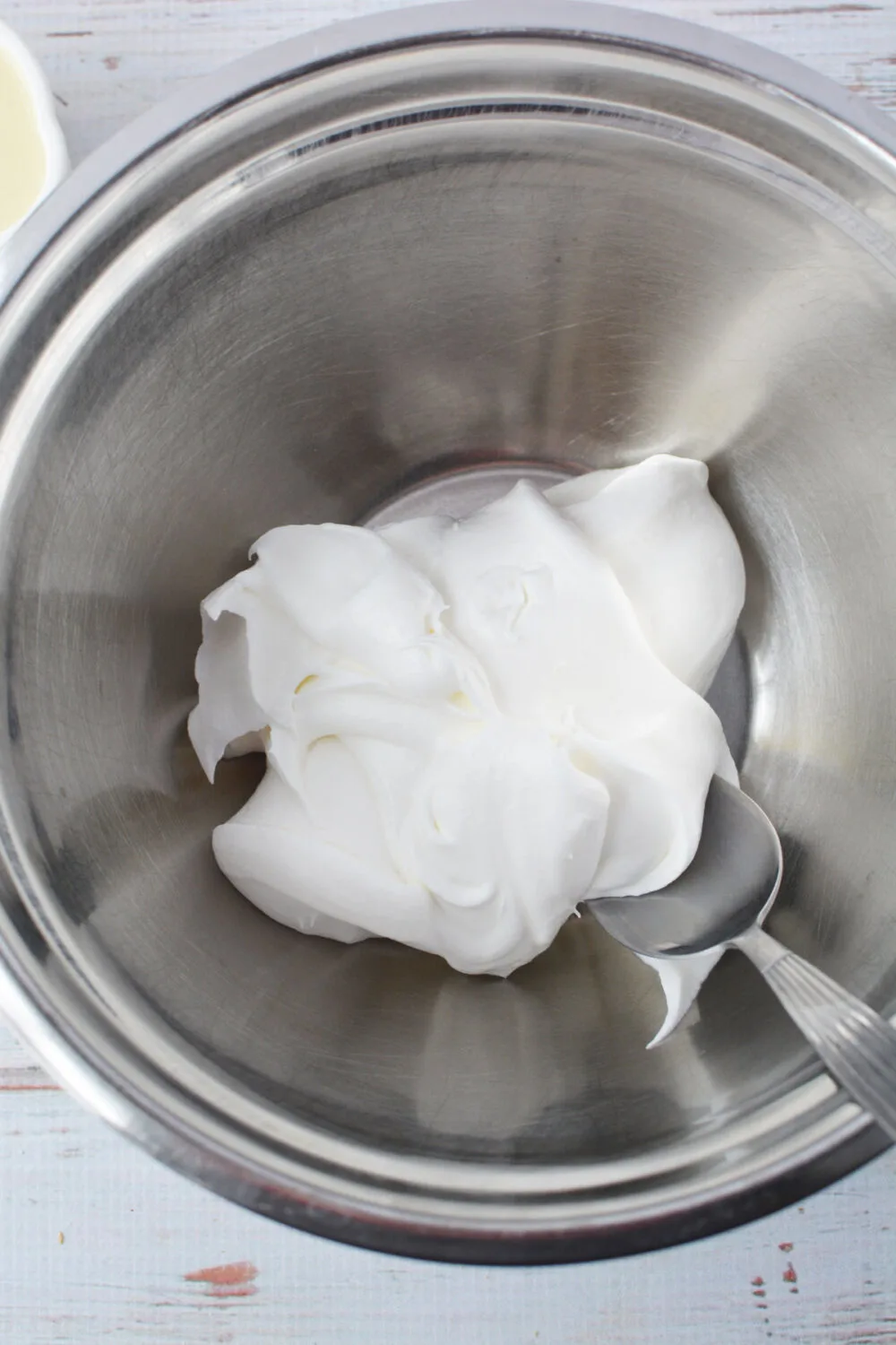 Whipped topping in a mixing bowl. 