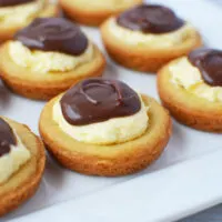 Plate of Boston custard pie cookies topped with chocolate.