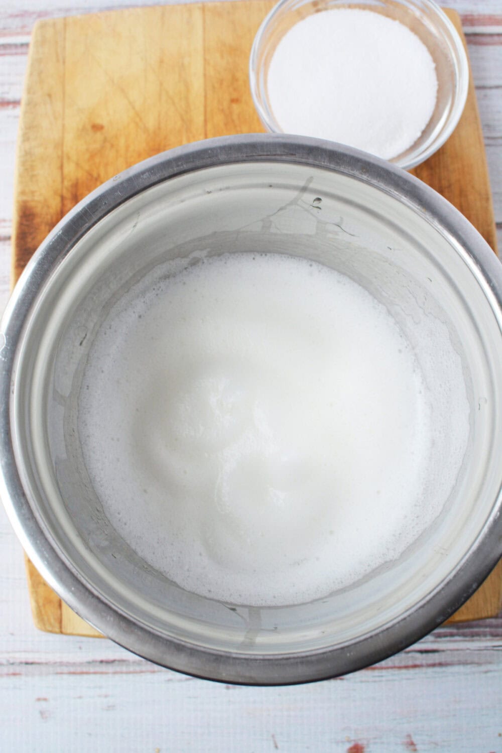 Whipped egg whites in a bowl. 