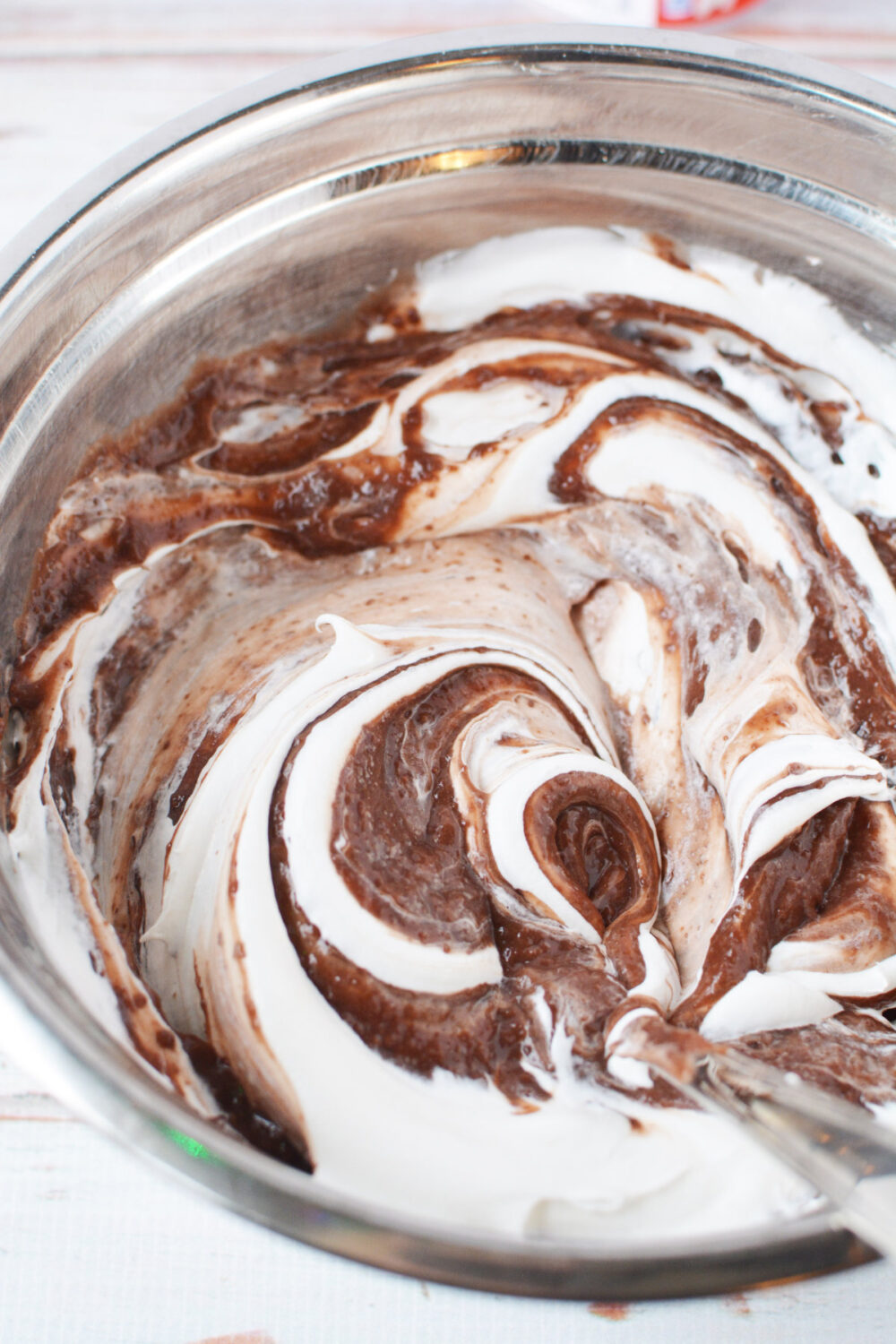 a bowl of brown and white swirls