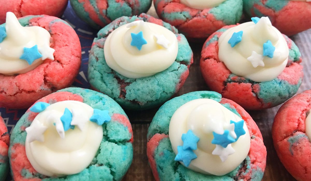 Red and blue cookies with a white frosting filling. 