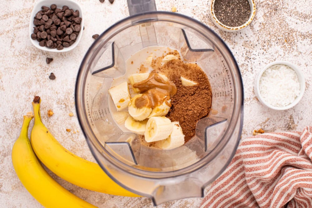 Banana, and other ingredients in a blender. 