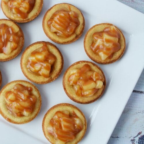 Caramel apple pie cookies on a white plate.