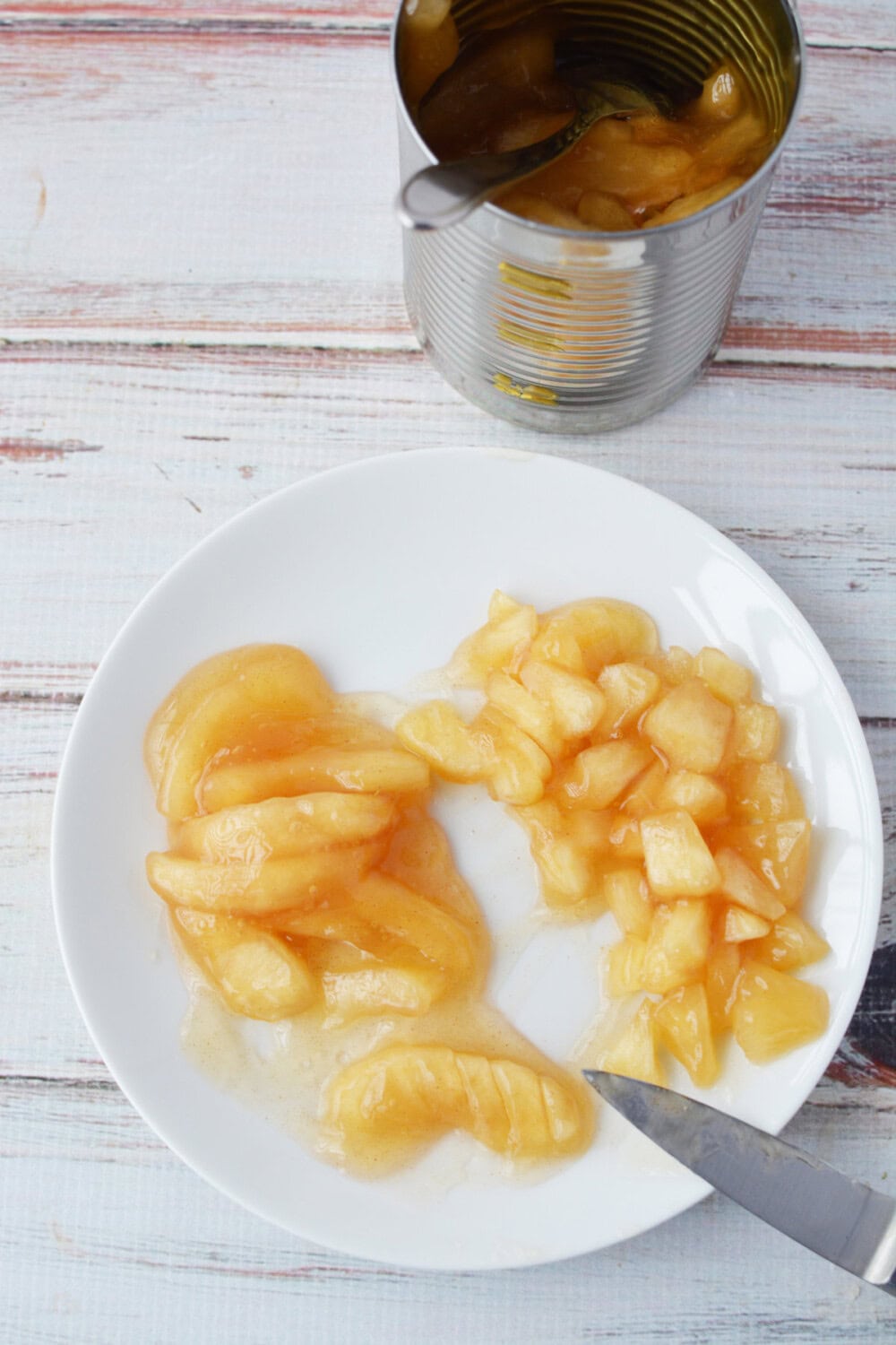 Cutting pie filling into smaller pieces. 