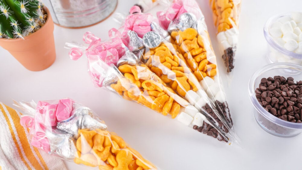 Pencil treat bags lined up on a table. 