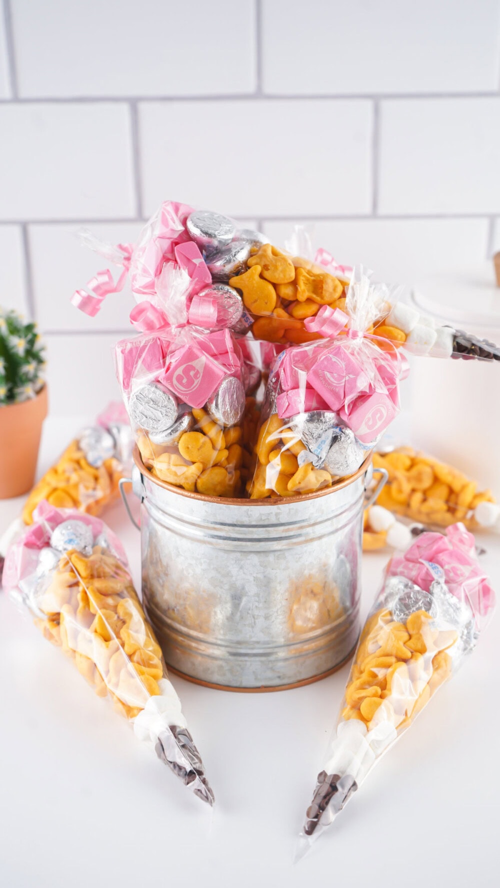 Bucket full of pencil snack bags. 